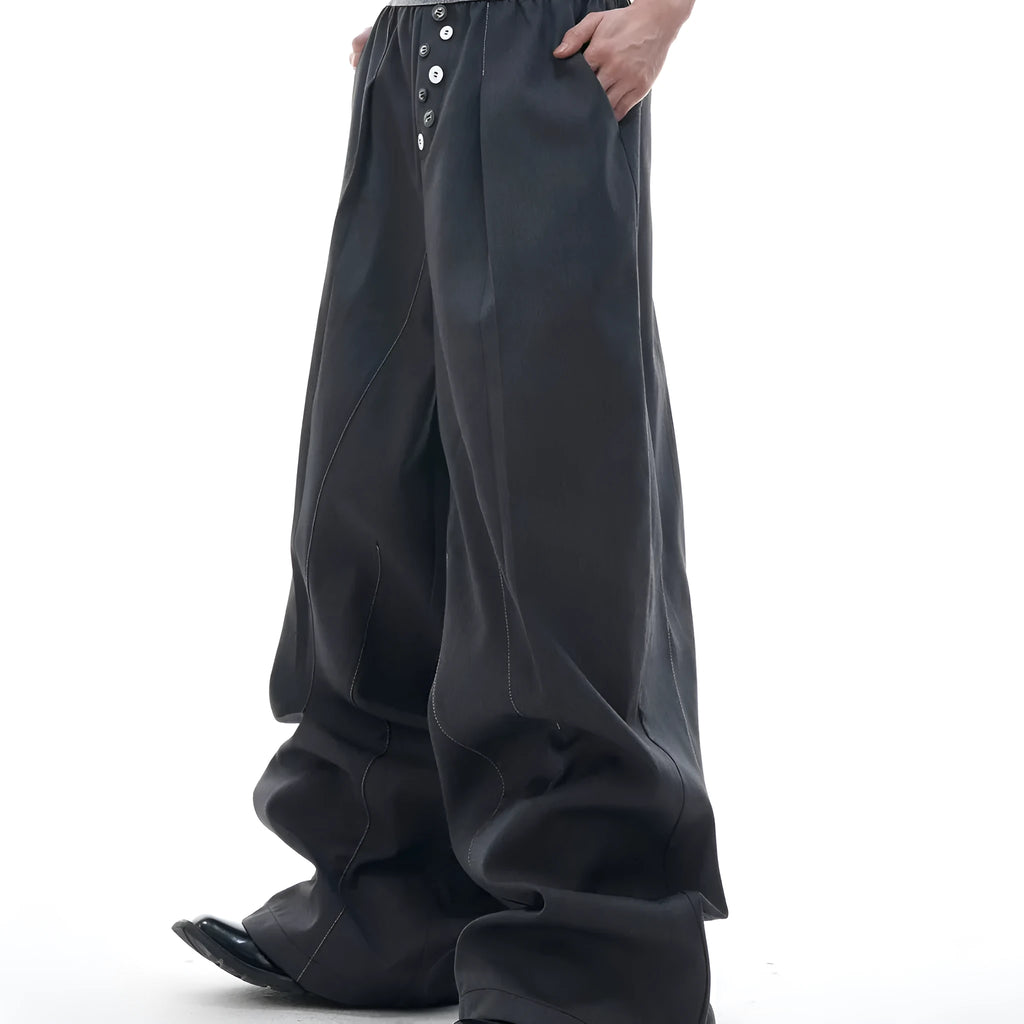 Drooping straight-leg trousers with button open line design in black and grey colours