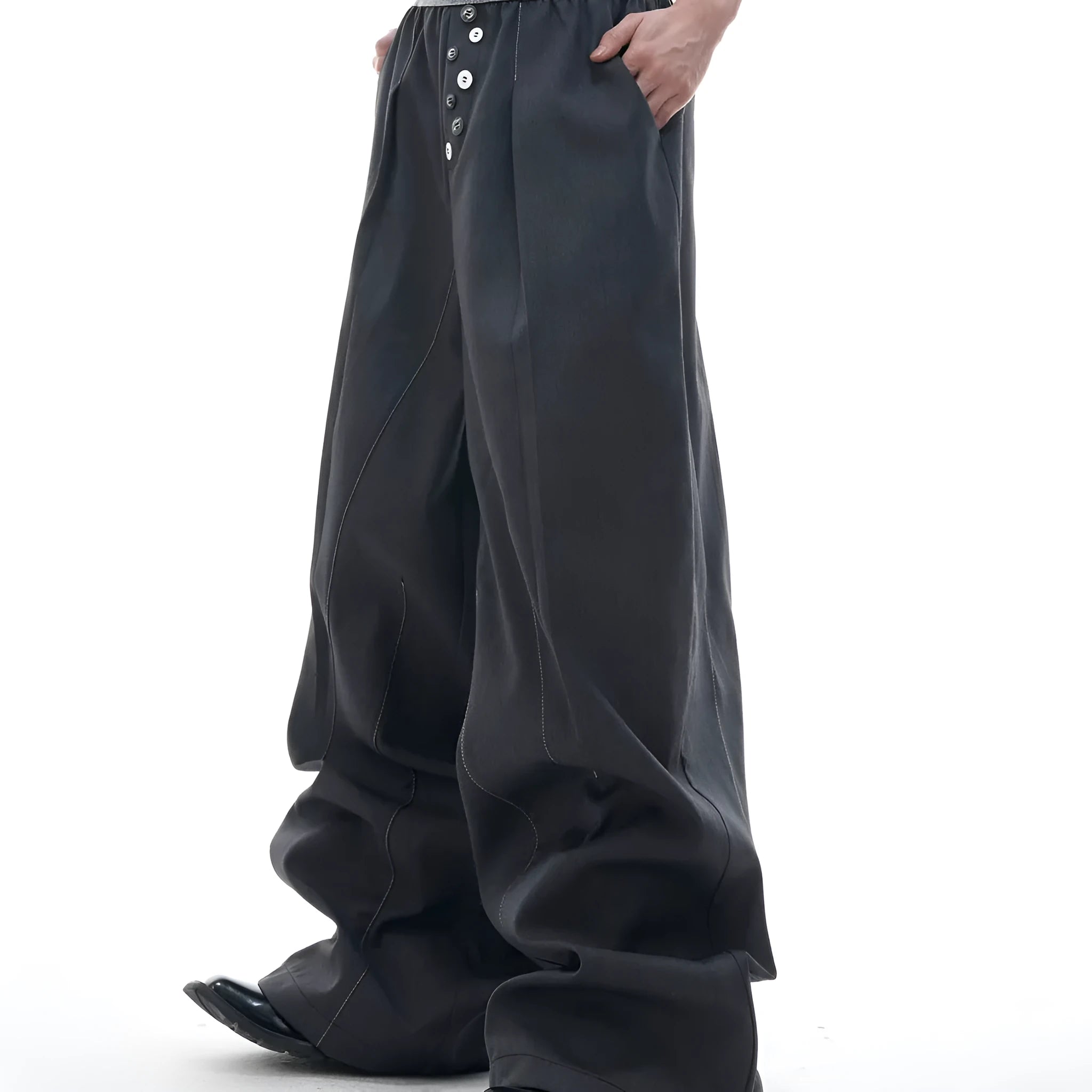 Drooping straight-leg trousers with button open line design in black and grey colours