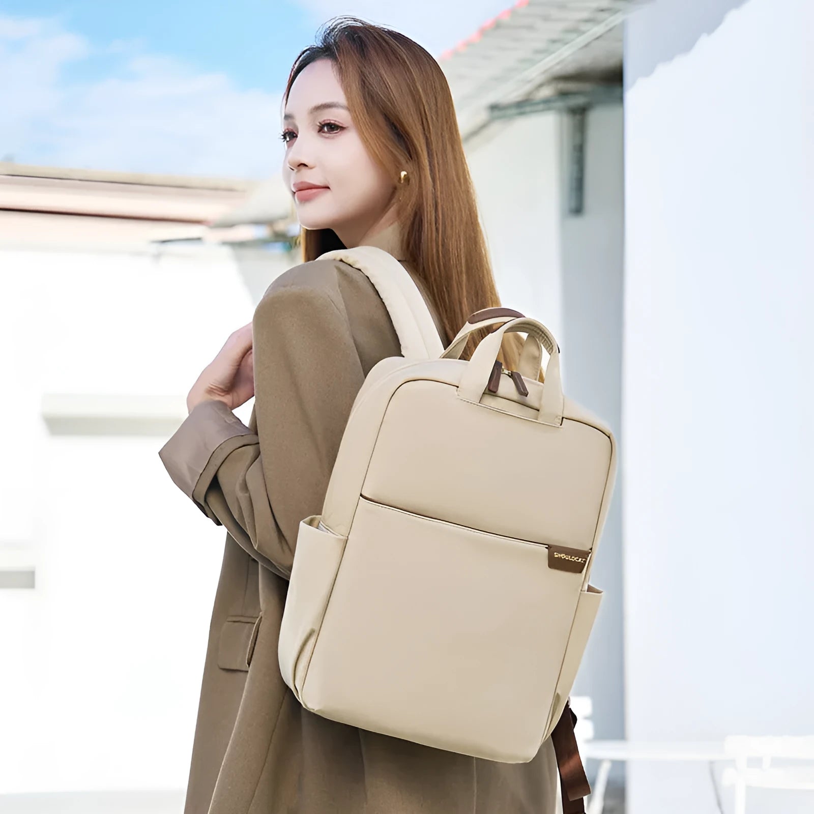 Large canvas travel backpack in apricot colour showing external pocket and urban style.