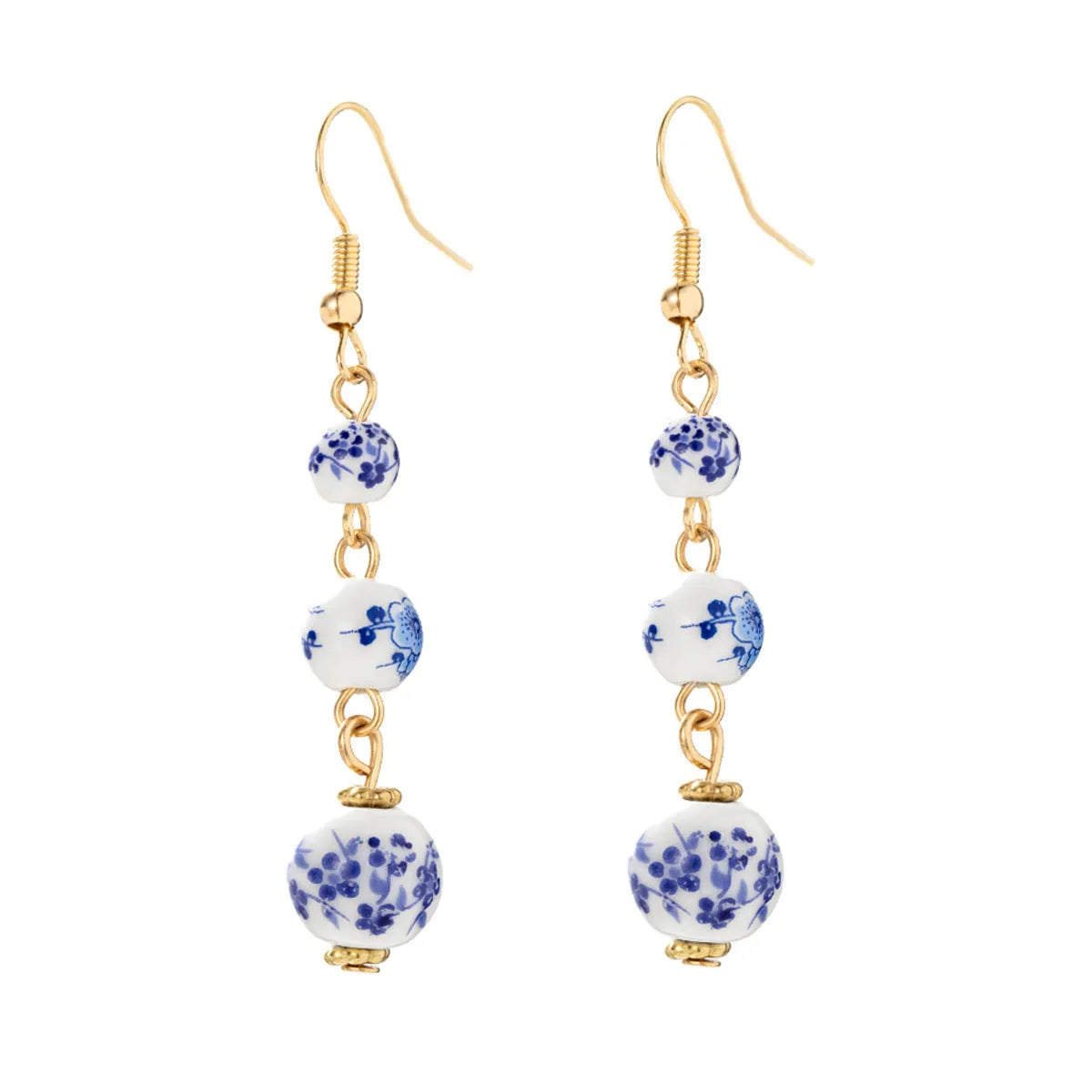 Long blue and white porcelain ceramic bead earrings with geometric Chinese-style design.