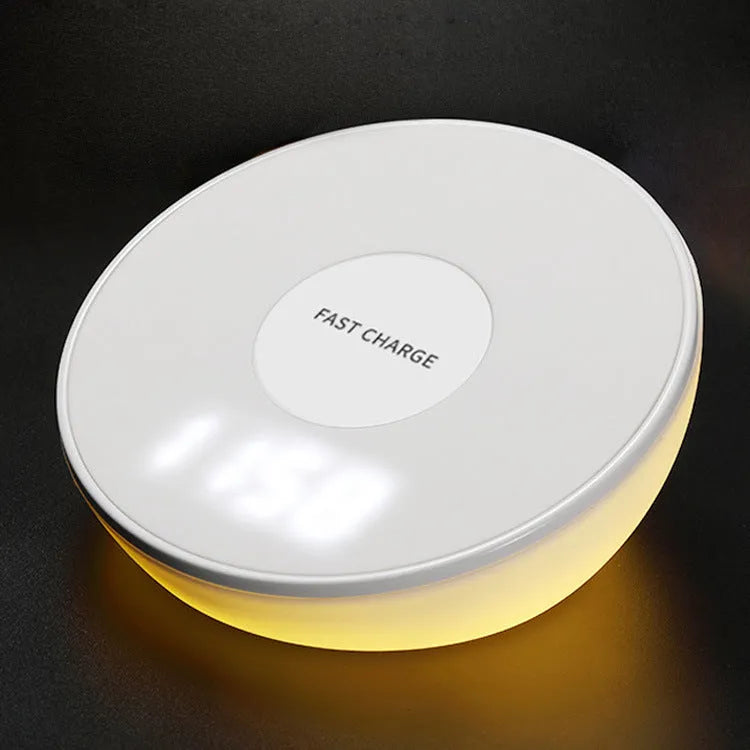 White wireless charging pad with digital clock display and control buttons