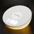 White wireless charging pad with digital clock display and control buttons