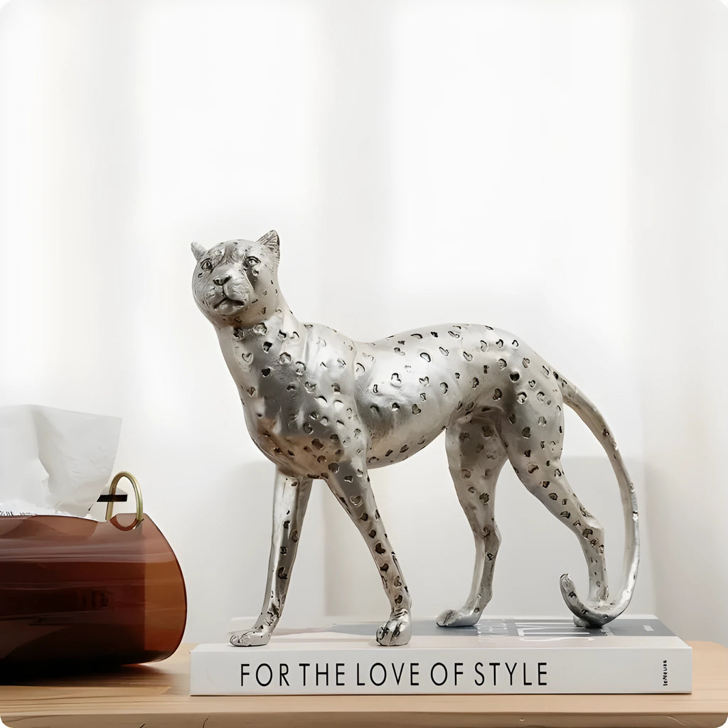 Modern resin leopard figurine ornament in American Leopard colour on a shelf.