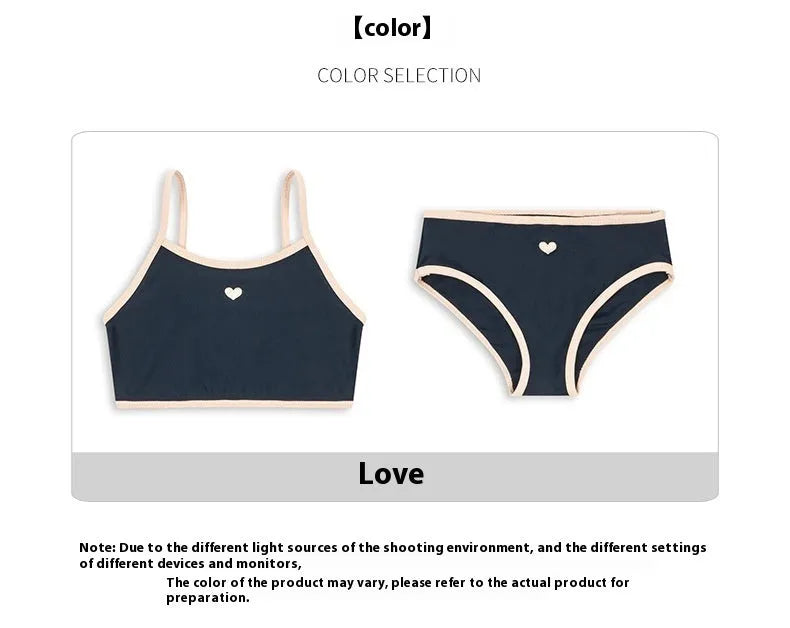 Dark blue split-style briefs swimsuit for baby girls, shown in sizes from 90cm to 130cm.