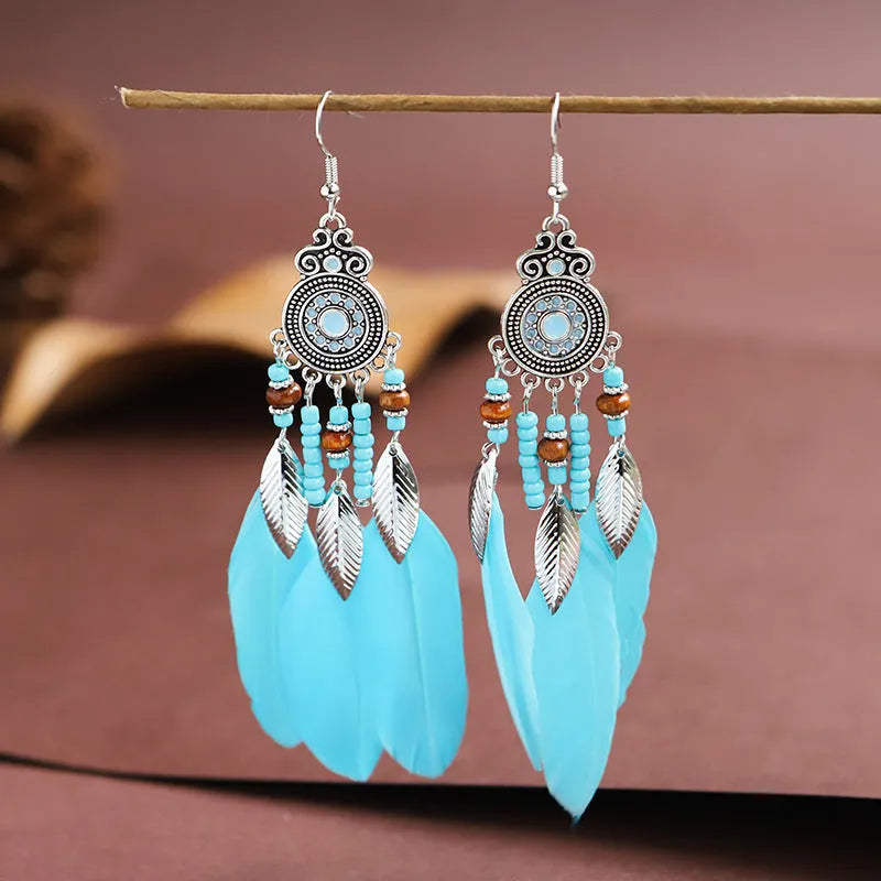 Retro feather drop earrings with leaf pattern in alloy material available in multiple colours