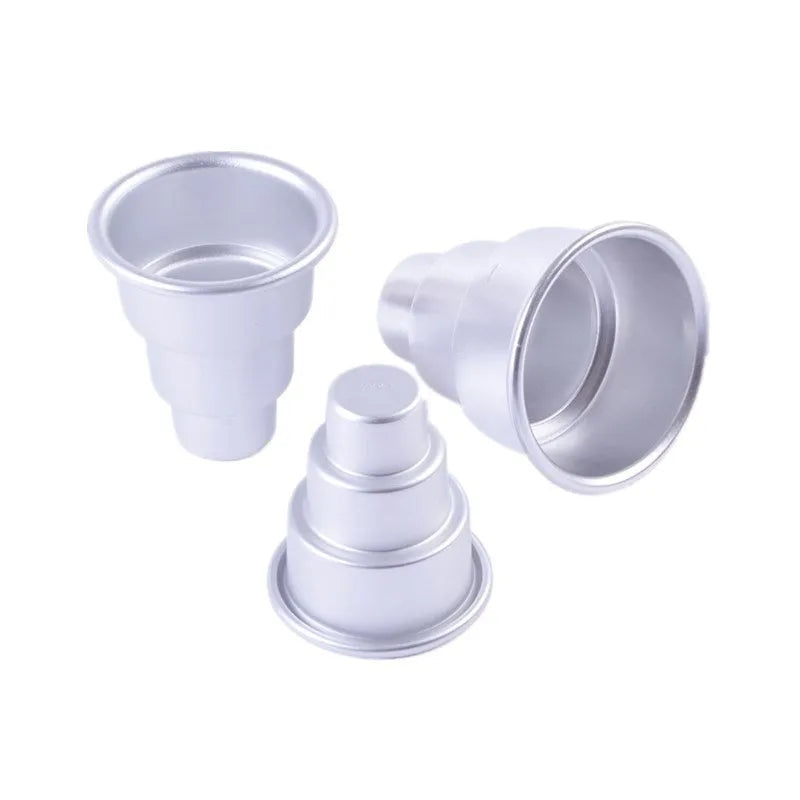 Set of three silver aluminium alloy round cake moulds in large, medium, and small sizes.