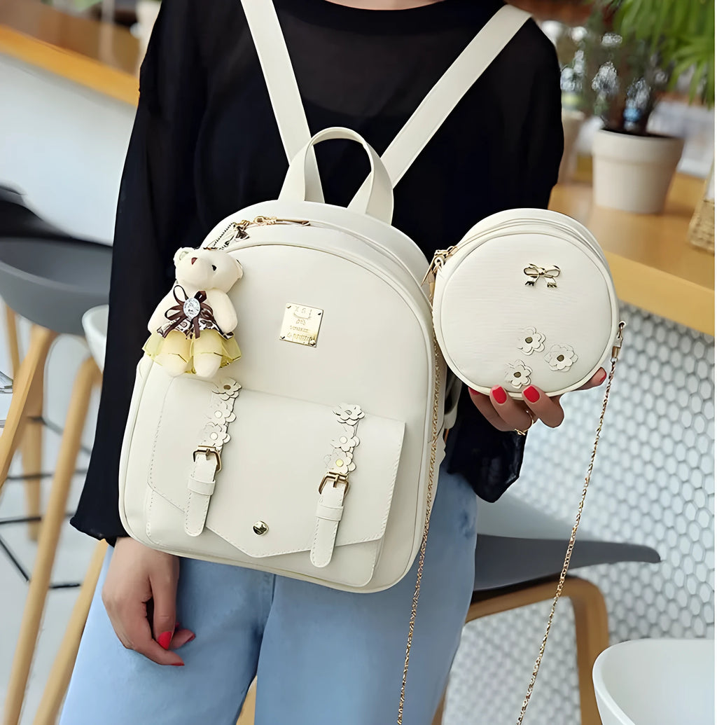 Women's three-piece PU leather bag set showing backpack, shoulder bag, and card holder in floral design.