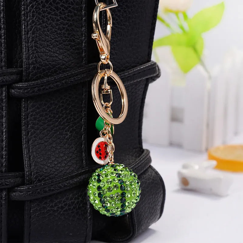 Green watermelon-shaped zinc alloy keychain with fruit diamond design measuring 12cm