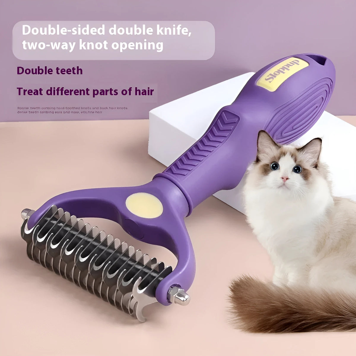 Purple double-sided plastic pet comb with ergonomic handle for removing tangles from cat and dog fur.