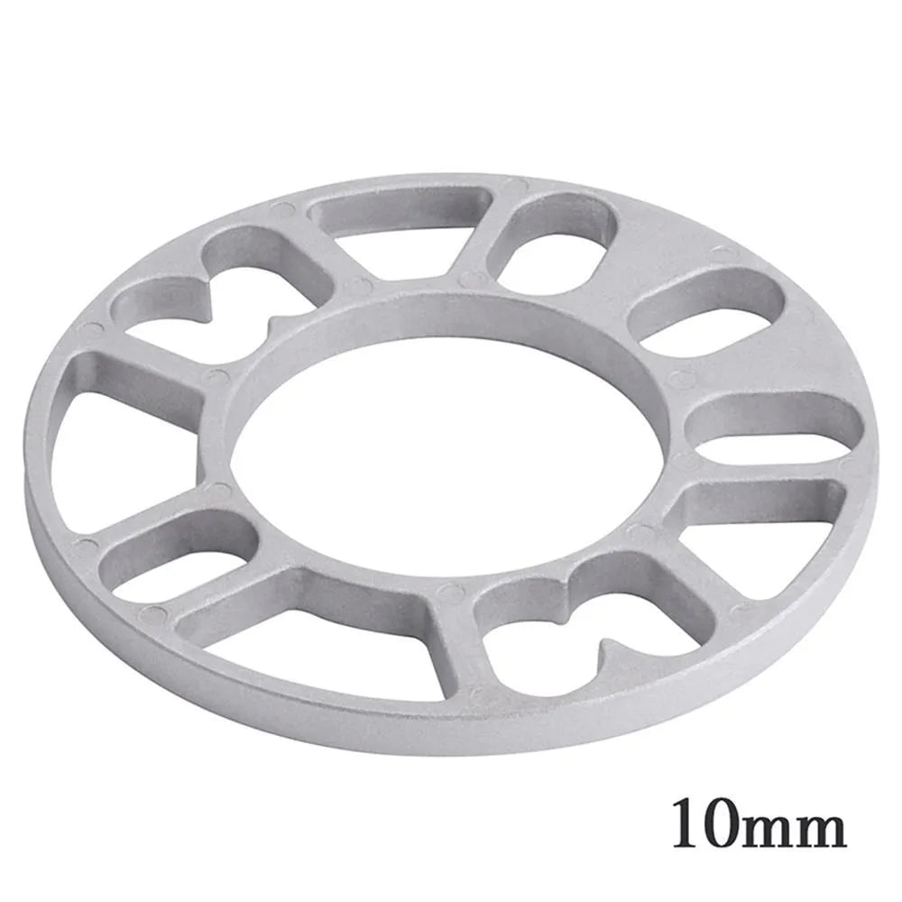 Automotive wheel hub widening spacer ET gasket in various thicknesses for brake caliper clearance.