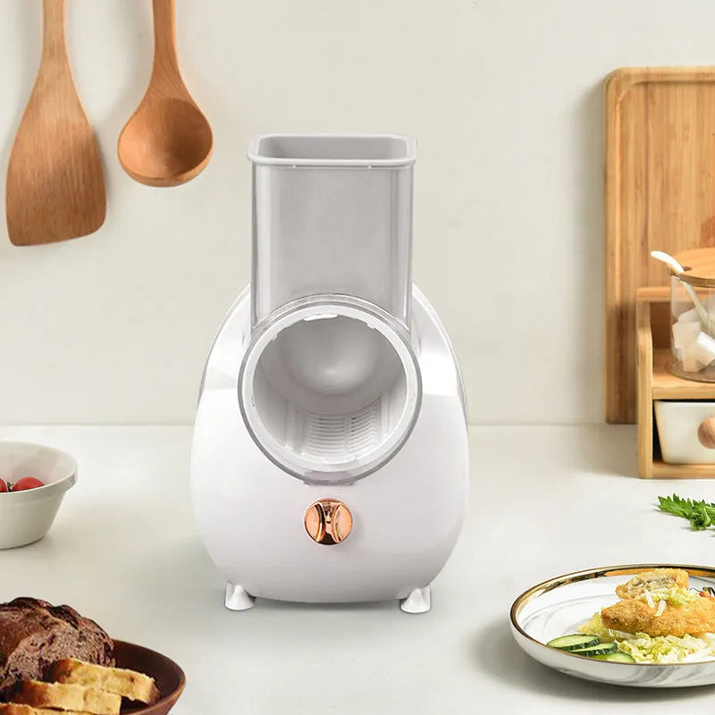White electric vegetable slicer with rotary grater and suction base for automatic food preparation