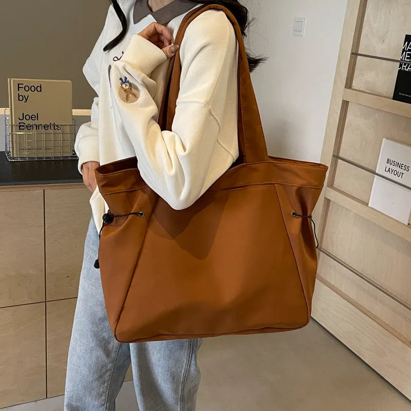 Soft folding Oxford cloth tote bag with shoulder handle in multiple colour options.