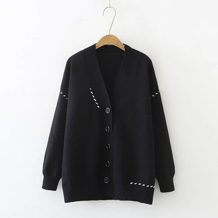 A loose-fitting black women's knitted cardigan top coat with long sleeves.