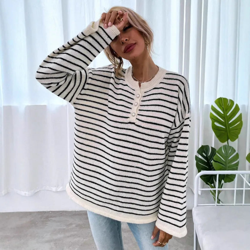 Black striped women's casual top with drop-shoulder sleeves and button detail
