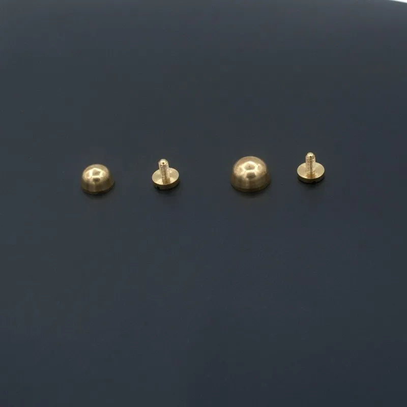 Brass decorative buckles in 10x6mm and 12x7mm sizes with round and geometric foot nail designs
