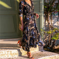 Women's vintage-inspired chiffon summer dress with V-neck and printed A-line skirt.