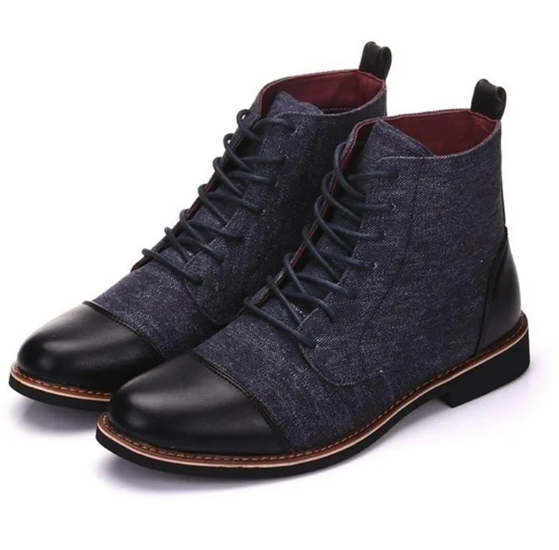 A pair of large leather boots for men with belt buckle detail and a rubber sole.