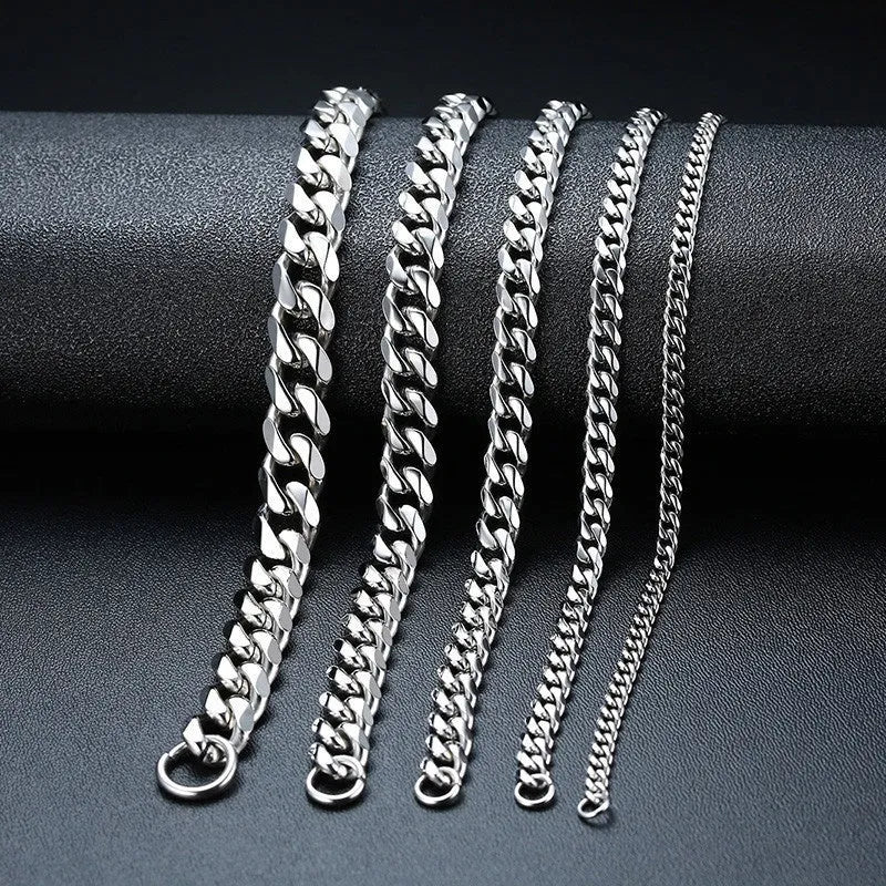 Six-sided geometric Cuban link chain bracelet in metal, shown in gold, black, and steel colour finishes.