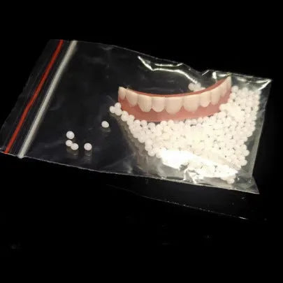 Silicone simulation dentures showing upper and lower teeth configuration in colour-coded box