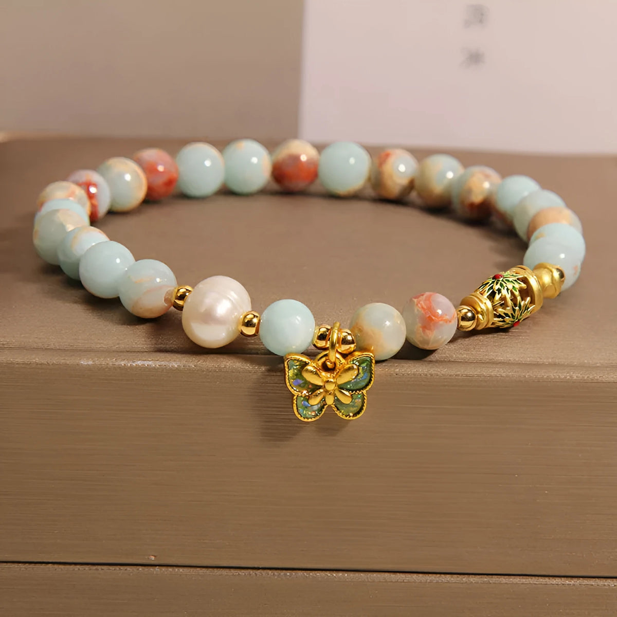 Blue women's bracelet with butterfly pendant, freshwater pearl, and Shoushan Stone elements