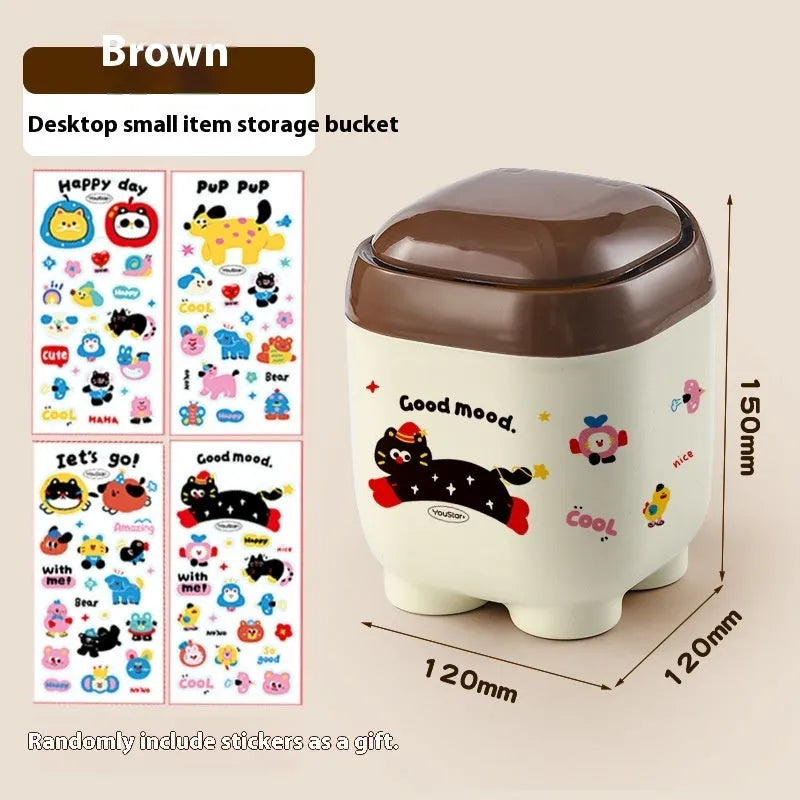 Cartoon-style plastic desktop organiser with grid compartments and labelling stickers for stationery storage