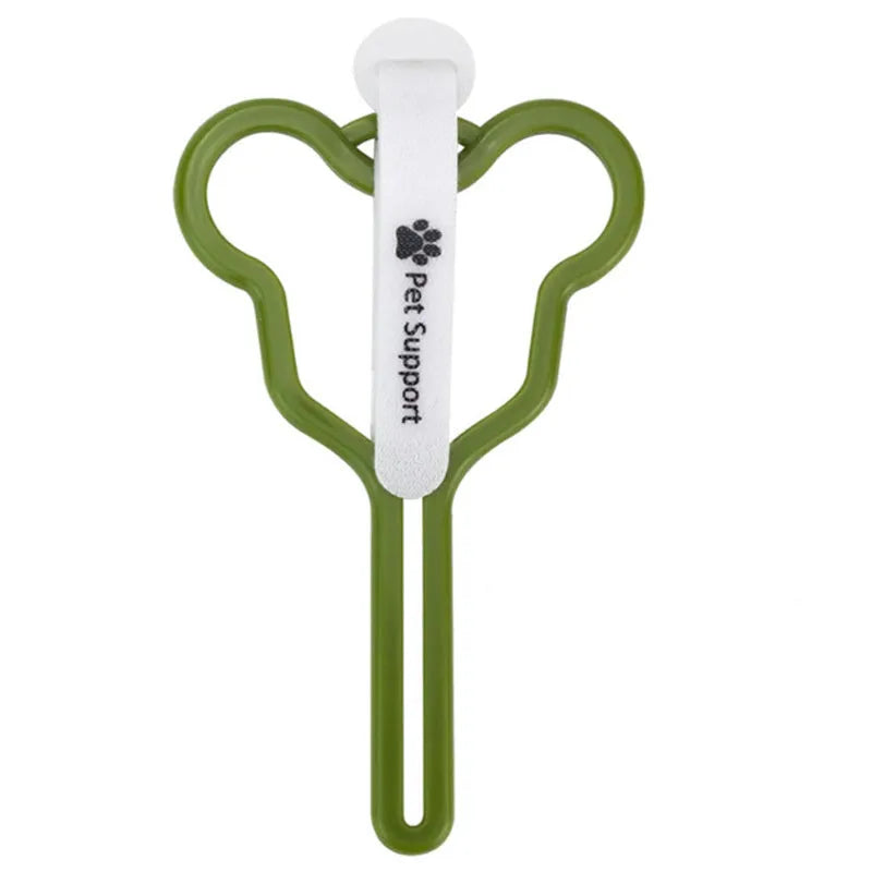 A hands-free dog poo bag holder with a fixed clip and adjustable Velcro strap attached to a dog lead.