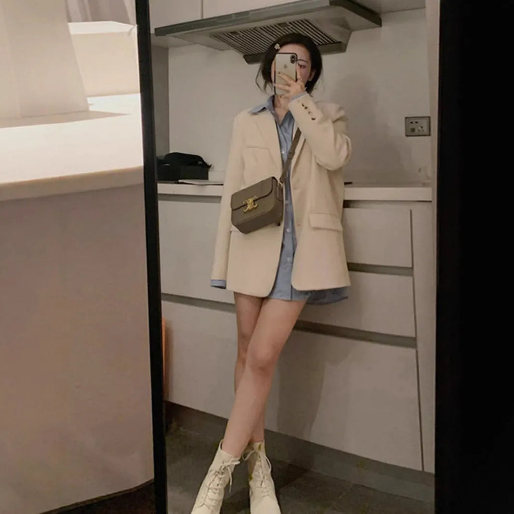 Women's Korean style solid color polyester suit jacket with regular long sleeves and pockets in black, beige, or coffee.