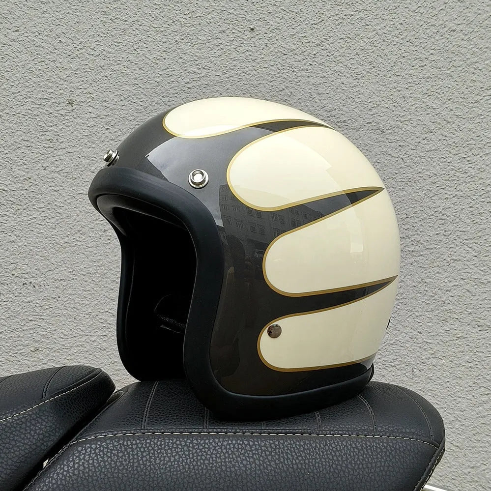Retro-style half-shell motorcycle helmet in fibreglass, shown in a cement grey colour option.
