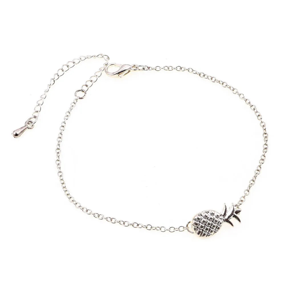 Gold or silver alloy bracelet with a simple pineapple charm pendant.