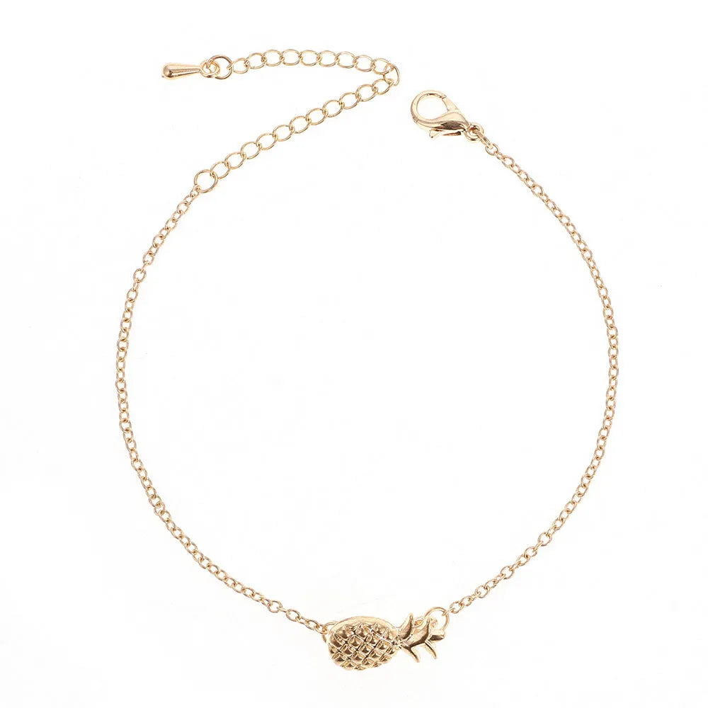 Gold or silver alloy bracelet with a simple pineapple charm pendant.