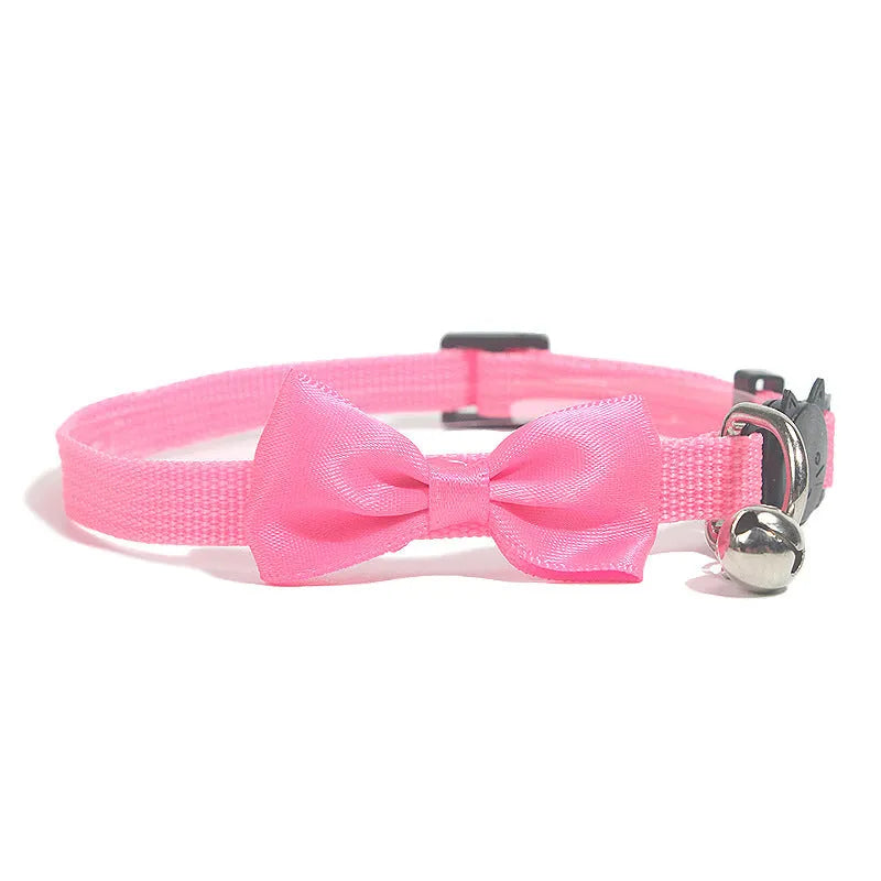 Adjustable striped nylon cat collar with bell in various colors including red, green, and blue