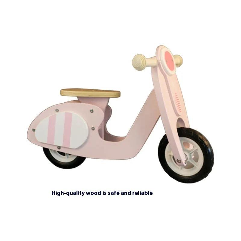 Pink wooden balance scooter for toddlers and children aged 1-6 years.