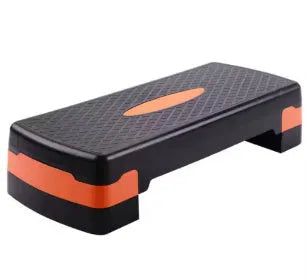 A grey ABS plastic step aerobics platform for fitness workouts, showing its size and textured surface.