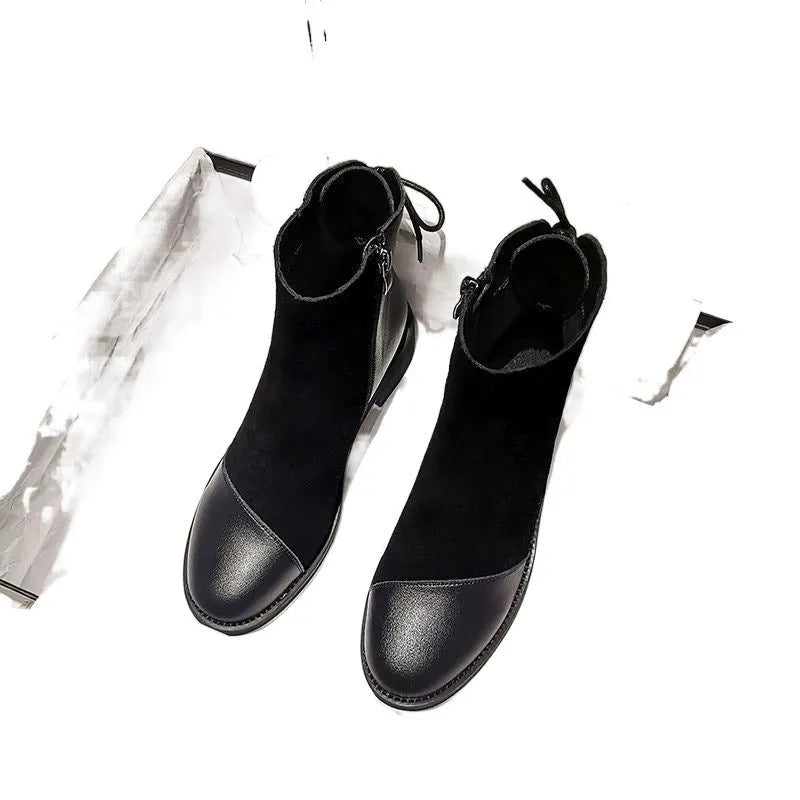 Black women's Martin Boots with knee-length design, side zip closure, and decorative bow detail