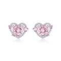White gold colour heart-shaped stud earrings for women on a jewellery card.