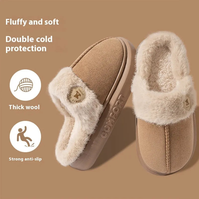 Pair of thick-soled plush fleece slippers in brown with car stitching detail on the upper.