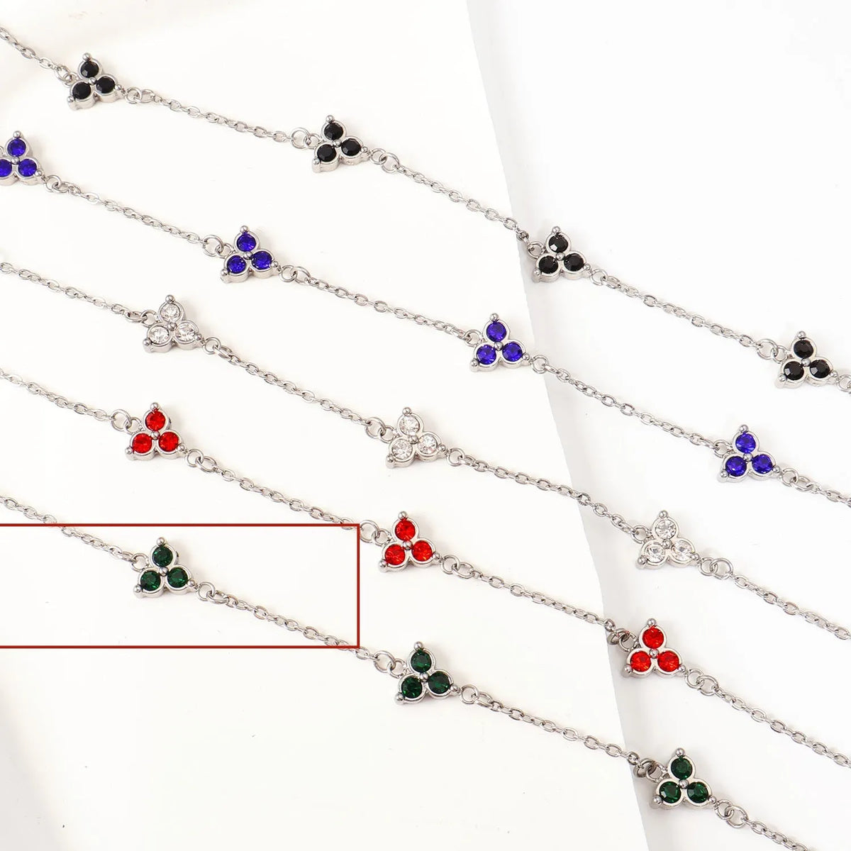 Women's geometric stainless steel bracelet with three-diamond triangle design and zircon stones