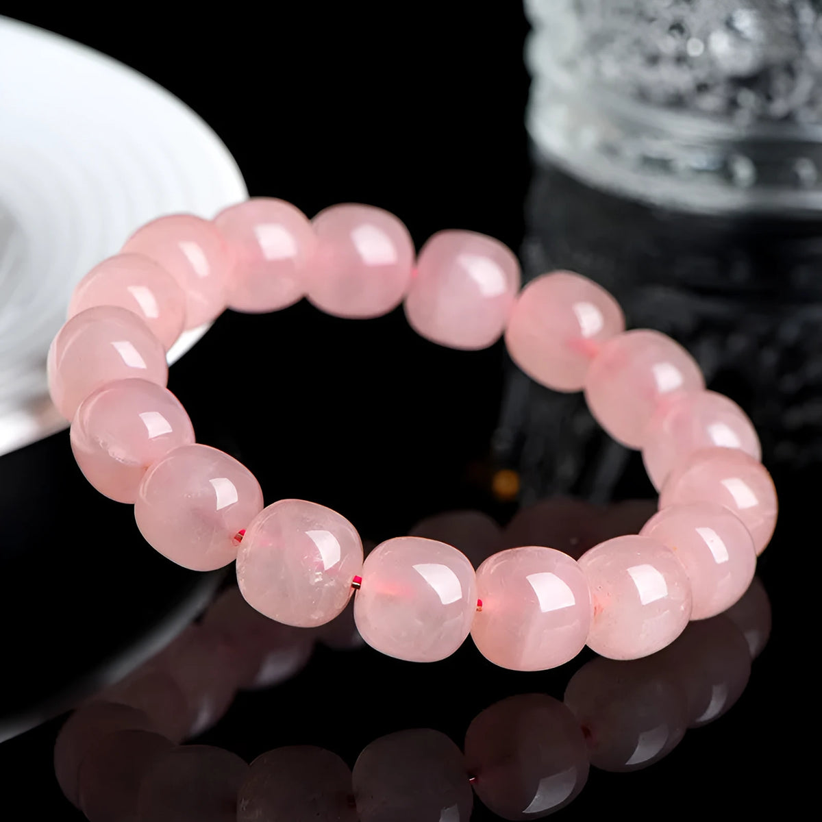 Natural pink crystal bracelet with barrel-shaped geometry beads measuring 8 x 10mm