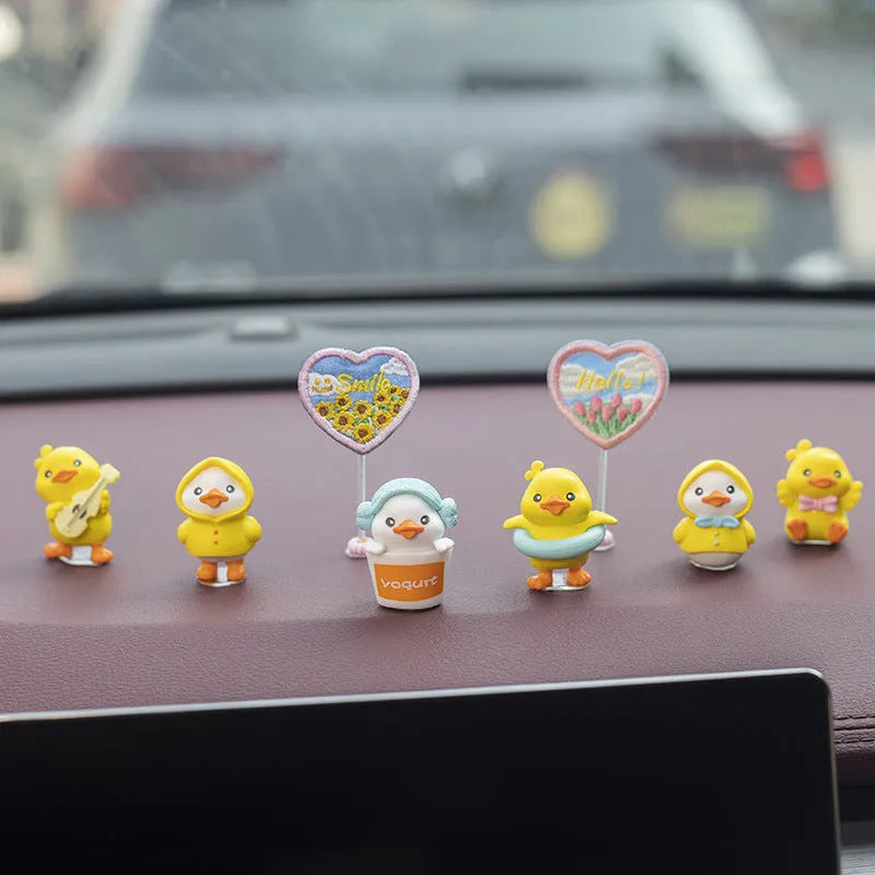 Six yellow PVC duckling ornaments and Hello sign for car dashboard decoration