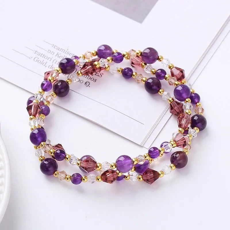 Women's adjustable crystal bracelet with three-ring beads on a cord in tourmaline, strawberry quartz, or amethyst