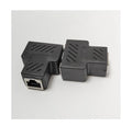 Two white RJ45 three-way network tee splitters on a table.