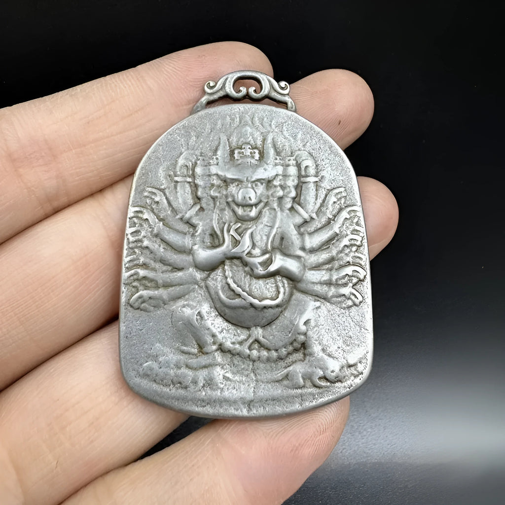 Chinese-style cast iron pendant ornament with Aryaacalanatha Yamantaka geometric design.