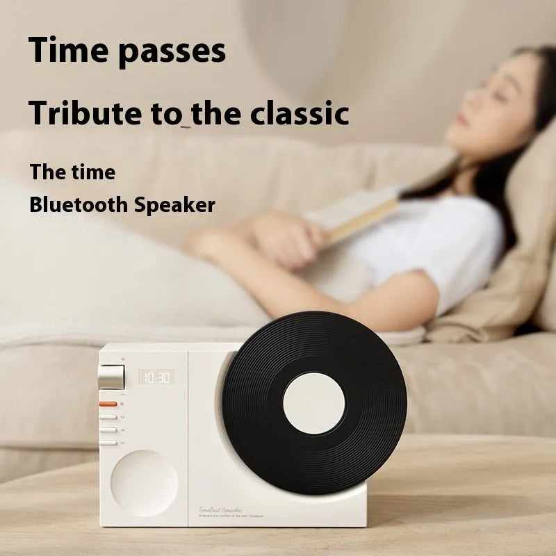 Mini Bluetooth speaker in Obsidian Black, Ivory White, Coral Pink, or Plum Green colours with USB charging port