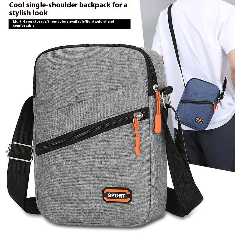 Ultra-light Oxford cloth crossbody commuter bag in solid colour with contrast trim.
