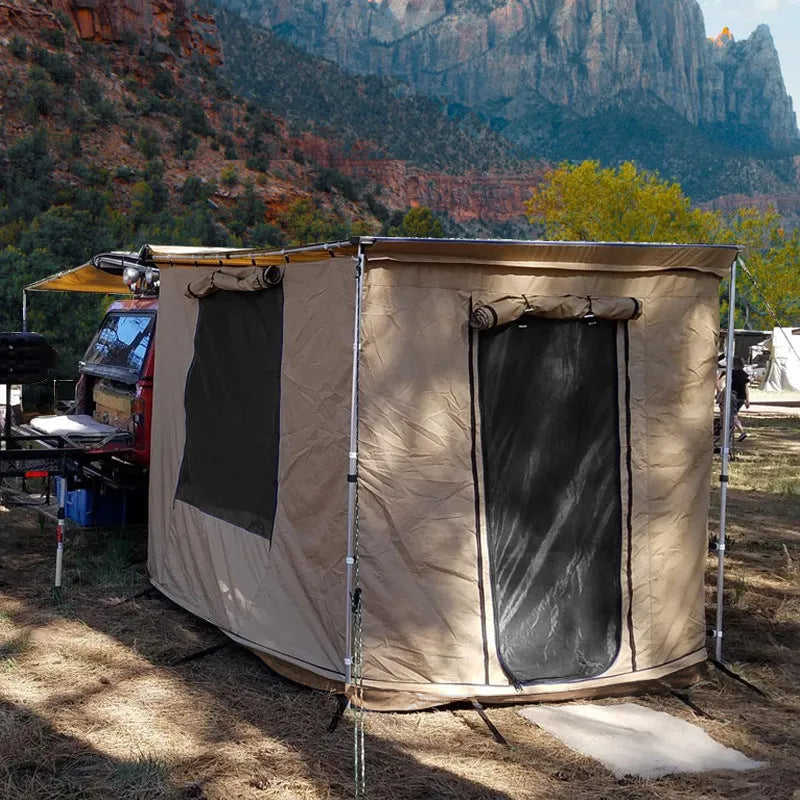 Black two-bedroom camping tent with aluminium alloy poles and Oxford cloth base erected outdoors.