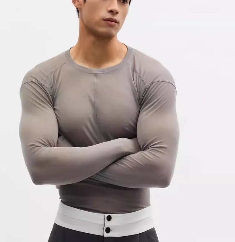 Black mesh see-through slim-fit long sleeve pullover top with round collar on a mannequin.