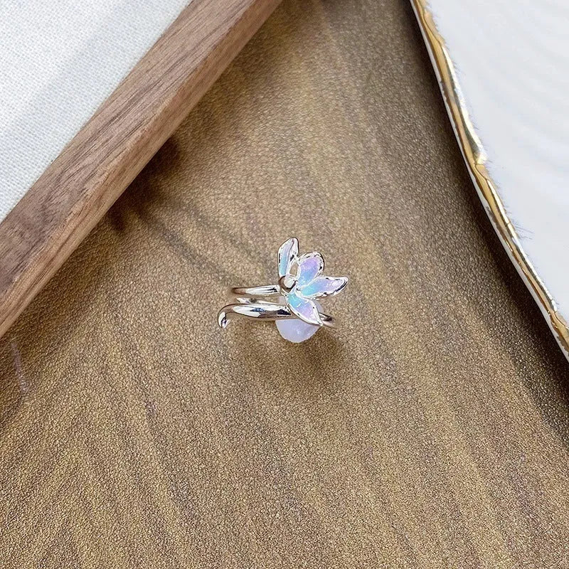 Adjustable copper insect motif ring with textured drip oil finish shown in available colour variations