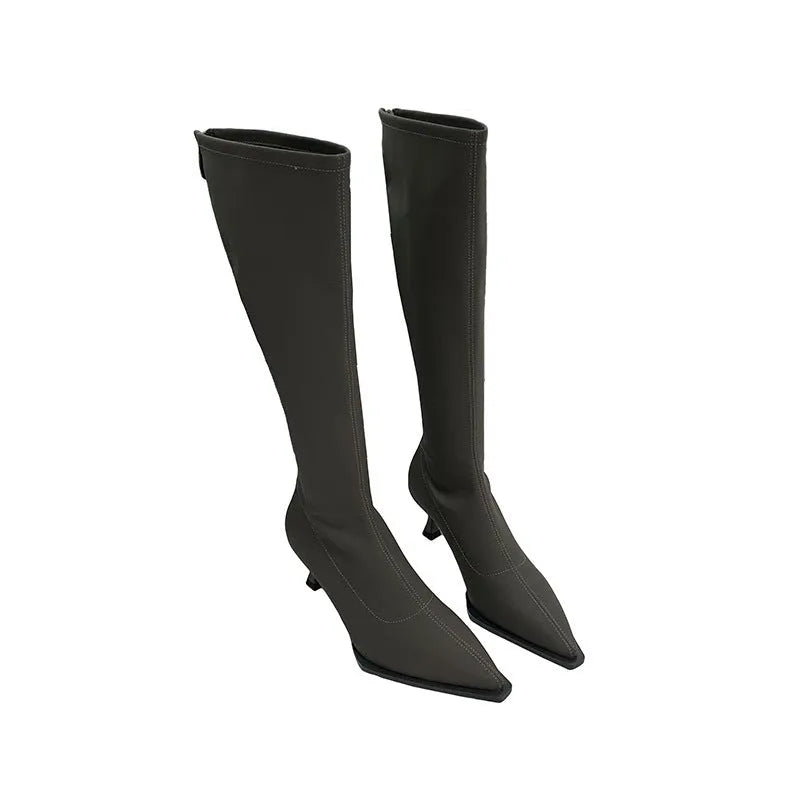 Women's black pointed-toe below-the-knee boots with a stiletto heel and a back zip fastening.