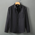 Long sleeve linen cardigan-style shirt in a solid colour, shown with a loose fit.