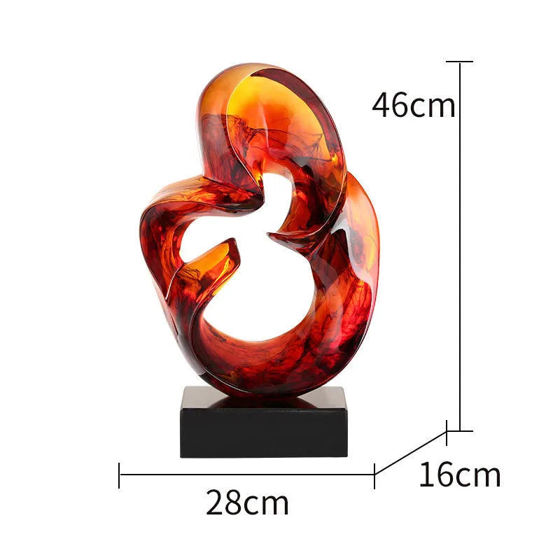 Clear transparent resin sculpture ornament in modern style on a shelf, shown in blue and orange red colour options.